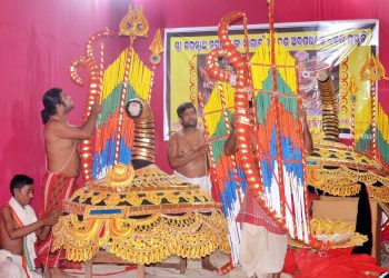 Artisans giving finishing touches to the special attire for Nagarjuna Besha Ritual