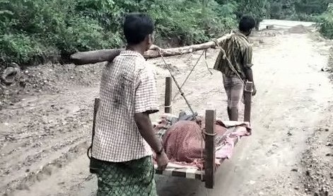 Bad road condition Elderly woman patient carried on cot in Malkangiri