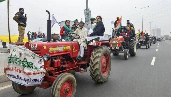 File photo of farmers holding a tractor rally during their ongoing protest against the new farm laws at Ghazipur near New Delhi (Photo Credit: PTI)