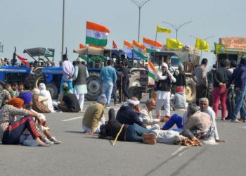 File photo of farmers blocking a road at Singhu border during their ‘chakka jam’ protest as part of the agitation over new farm laws near New Delhi. (PC: PTI Photo)