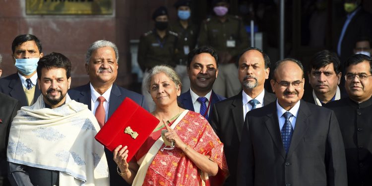 New Delhi: Finance Minister Nirmala Sitharaman holds a folder case containing the Union Budget 2021-22 as she poses for a group photograph with MoS Finance Anurag Thakur and other members of finance ministry, at North Block in New Delhi, Monday, Feb. 1, 2021. (PTI Photo/Kamal Singh)(PTI02_01_2021_000015A)(PTI02_01_2021_000018B)