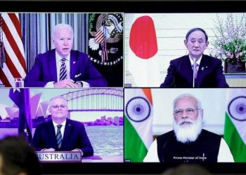A monitor displaying a virtual meeting with U.S. President Joe Biden (top L), Australia's Prime Minister Scott Morrison (bottom L), Japan's Prime Minister Yoshihide Suga (top R) and India's Prime Minister Narendra Modi is seen during the virtual Quadrilateral Security Dialogue (Quad) meeting, at Suga's official residence in Tokyo March 12, 2021. (PC: onmanorama.com)