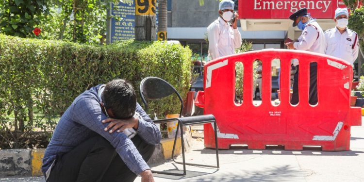 A man breaks down after losing his relative at Jaipur Golden Hospital in New Delhi’s Rohini area. (File Photo: PTI)