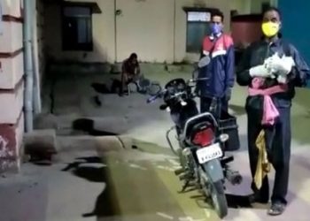 Bargarh Raincoat clad COVID patient rides to hospital in absence of ambulance, PPE kit 