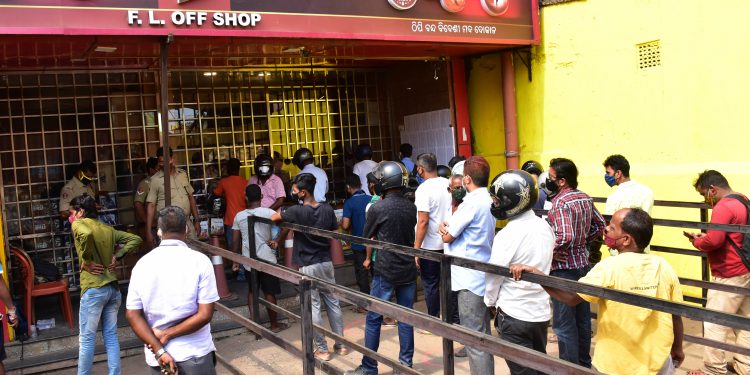 Denizens crowd liquor shops