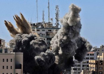 Israeli airstrikes destroy an office building in Gaza    AP photo