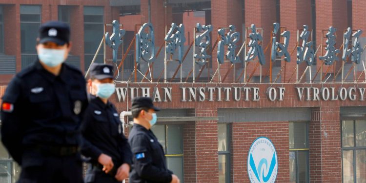 Security personnel keep watch outside the Wuhan Institute of Virology during the visit by the World Health Organization team tasked with investigating the origins of Covid-19, in Wuhan 	(REUTERS FILE PHOTO)