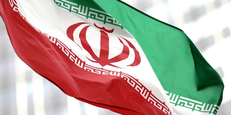 FILE PHOTO: Iranian flag flies in front of the UN office building, housing IAEA headquarters, amid the coronavirus disease (COVID-19) pandemic, in Vienna, Austria, May 24, 2021. REUTERS/Lisi Niesner