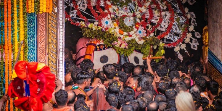 Lord Jagannath being escorted to His chariot Nandighosha