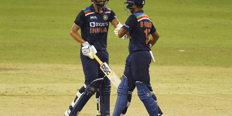 Deepak Chahar (L) gives Bhuvneshwar Kumar a 
fist-bump during their match-winning partnership against Sri Lanka