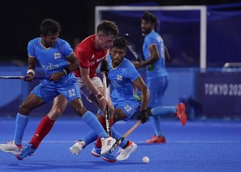 Tokyo: Britain's Thomas Sorsby, center left, drives the ball against India's Vivek Sagar Prasad (32) and Varun Kumar (22) during a men's field hockey match at the 2020 Summer Olympics, Sunday, Aug. 1, 2021, in Tokyo, Japan. AP/PTI(AP08_01_2021_000215B)