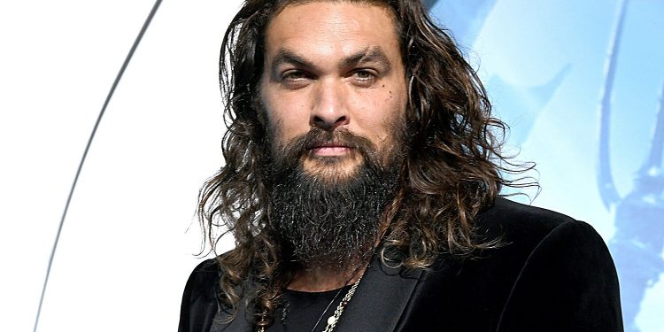 LOS ANGELES, CA - DECEMBER 12:  Jason Momoa arrives at the premiere of Warner Bros. Pictures' "Aquaman" at the Chinese Theatre on December 12, 2018 in Los Angeles, California.  (Photo by Kevin Winter/Getty Images)