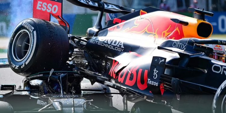 The rear wheel of Max Verstappen’s car is inches away from Lewis Hamilton’s head