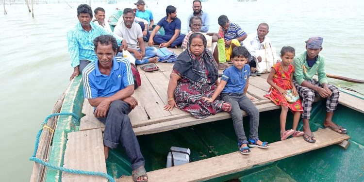 Health workers carry Covid-19 swab samples on passenger boats