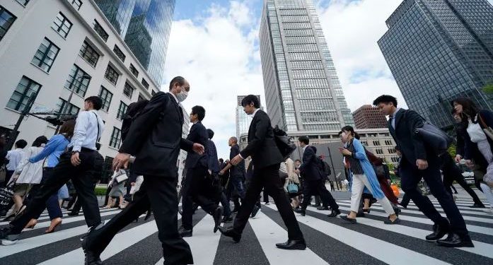 Japan revises GDP to nearly flat, shows fragile recovery