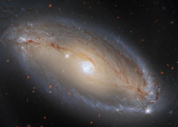 Hubble spots spiral galaxy with celestial eye(Image credit: ESA/Hubble, A. Riess et al., J. Greene)