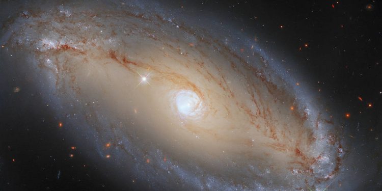 Hubble spots spiral galaxy with celestial eye(Image credit: ESA/Hubble, A. Riess et al., J. Greene)