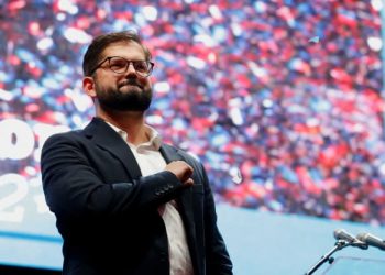 Gabriel Boric gestures as he celebrates with supporters after winning the presidential election in Santiago, Chile, December 19, 2021. (Rodrigo Garrido | Reuters via cnbc.com)