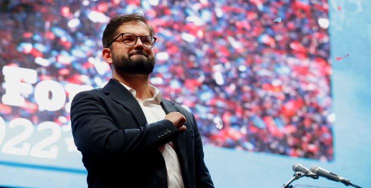 Gabriel Boric gestures as he celebrates with supporters after winning the presidential election in Santiago, Chile, December 19, 2021. (Rodrigo Garrido | Reuters via cnbc.com)