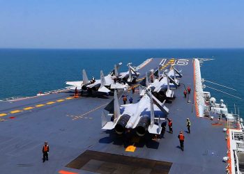 This file photo shows J15 fighter jets on China's sole operational aircraft carrier, the Liaoning, during a drill at sea. (AFP photo via theaseanpost.com)