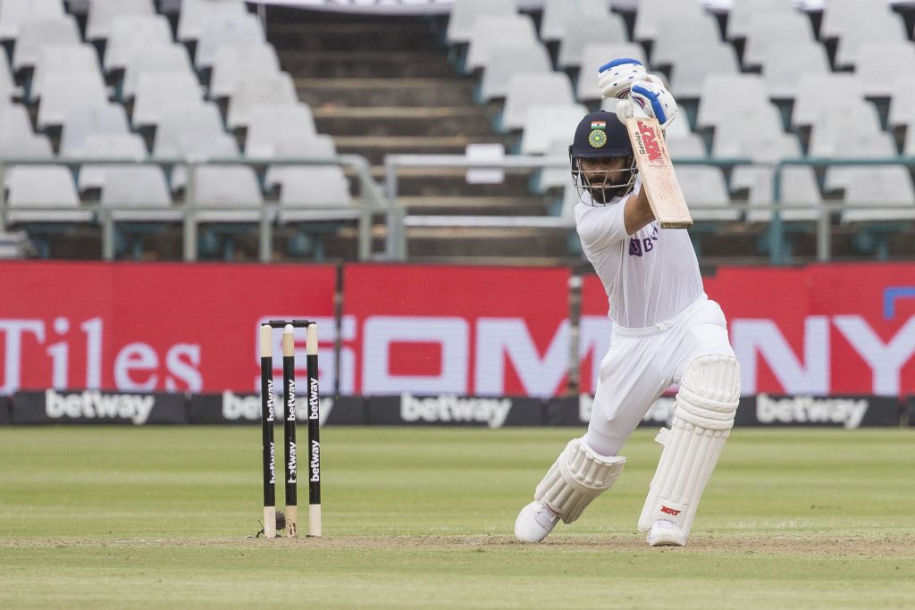 Virat Kohl drives during his fighting half century