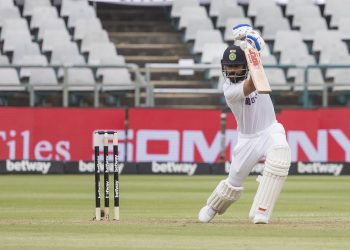 Virat Kohl drives during his fighting half century