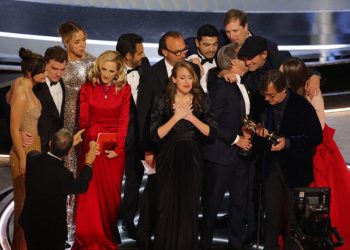 Philippe Rousselet, Fabrice Gianfermi and Patrick Wachsberger win the Oscar for Best Picture for "CODA" at the 94th Academy Awards in Hollywood, Los Angeles, California, U.S., March 27, 2022. REUTERS/Brian Snyder