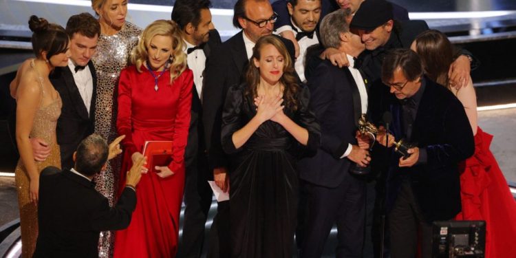 Philippe Rousselet, Fabrice Gianfermi and Patrick Wachsberger win the Oscar for Best Picture for "CODA" at the 94th Academy Awards in Hollywood, Los Angeles, California, U.S., March 27, 2022. REUTERS/Brian Snyder