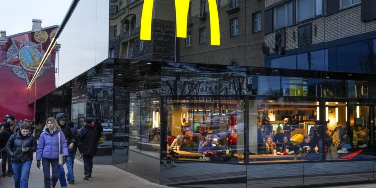 People eat in a McDonald’s restaurant in the main street in Moscow, Russia. (File: AP Photo)
