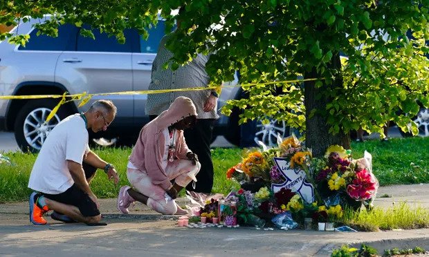 People pay their respects outside the scene of a shooting at a supermarket in Buffalo, New York. (Photograph: Matt Rourke/AP via theguardian.com)