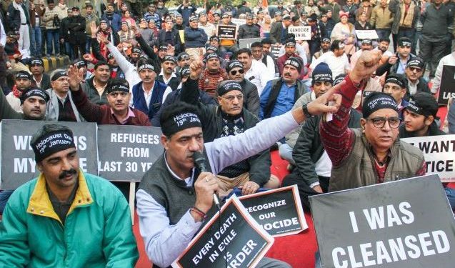 Kashmiri Pandit murder: J&K admin moves to attach house of terrorist; protest held in Jammu Srinagar/Jammu: The Jammu and Kashmir administration Wednesday initiated the process of attaching the house of a terrorist who killed a Kashmiri Pandit in Shopian, even as the minority community held a massive protest in Jammu against the latest killing. Police have also arrested father and three brothers of Adil Wani, a categorised terrorist of Al-Badr outfit, for sheltering him after he killed the Kashmiri Pandit and injured his brother on Tuesday. Police said Wani killed Sunil Kumar Bhat in an orchard in a Shopian village on Tuesday and later took shelter at his home in Kutpora. The security forces launched a cordon and search operation but Wani fled in the cover of darkness after hurling grenades at the approaching police party, they said. During the search operation, police also recovered arms and ammunition from Wani's house, prompting the authorities to place his father and three brothers under arrest, besides initiating the process of attaching their house. Wani was identified by eyewitnesses and Sunil Kumar's cousin as the person who fired indiscriminately at him and his brother while they were working in the apple orchard on Tuesday. Earlier this year, the Jammu and Kashmir Police had announced that it would start the process of "attachment of some immovable properties which have been used for purpose of terrorism as per section 2(g) and 25 of the Unlawful Activities (Prevention) Act" and asked people not to shelter or harbour terrorists/terror associates. Meanwhile, Kashmiri Pandits serving in the Valley held a massive protest against the killing of their community member in Shopian and demanded that the employees in Kashmir under the prime minister's package be relocated to Jammu in view of selective and targeted killings. Hundreds of Kashmir-posted KP employees, who are on strike and have been protesting for past three months here in support of their relocation to safer areas in Jammu, assembled at relief commissioner's office and took out a rally to protest the fresh killing in the Valley. They were also joined by activists of various Kashmiri Pandit organisations. Raising 'Bharat Mata Ki jai' and 'Justice for KPs' relocation' slogans, they took out the protest rally and jammed the Tawi bridge on the highway for hours. They sat on a dharna for two hours on the bridge. Police had to face a tough time to remove them from the bridge and clear the highway. The protesters also briefly clashed with police who were forcibly evicting them from the bridge to restore the traffic. "We have only one demand of relocation of our postings from Kashmir to Jammu as selective killings of Kashmiri Pandits continue unabated. We have been made sitting ducks for target practice of terrorists," a protesting employee, Sunil, told reporters. PTI Kashmiri Pandit, murder, J&K, terrorism, Jammu