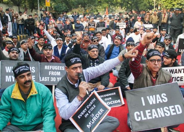 Kashmiri Pandit murder: J&K admin moves to attach house of terrorist; protest held in Jammu Srinagar/Jammu: The Jammu and Kashmir administration Wednesday initiated the process of attaching the house of a terrorist who killed a Kashmiri Pandit in Shopian, even as the minority community held a massive protest in Jammu against the latest killing. Police have also arrested father and three brothers of Adil Wani, a categorised terrorist of Al-Badr outfit, for sheltering him after he killed the Kashmiri Pandit and injured his brother on Tuesday. Police said Wani killed Sunil Kumar Bhat in an orchard in a Shopian village on Tuesday and later took shelter at his home in Kutpora. The security forces launched a cordon and search operation but Wani fled in the cover of darkness after hurling grenades at the approaching police party, they said. During the search operation, police also recovered arms and ammunition from Wani's house, prompting the authorities to place his father and three brothers under arrest, besides initiating the process of attaching their house. Wani was identified by eyewitnesses and Sunil Kumar's cousin as the person who fired indiscriminately at him and his brother while they were working in the apple orchard on Tuesday. Earlier this year, the Jammu and Kashmir Police had announced that it would start the process of "attachment of some immovable properties which have been used for purpose of terrorism as per section 2(g) and 25 of the Unlawful Activities (Prevention) Act" and asked people not to shelter or harbour terrorists/terror associates. Meanwhile, Kashmiri Pandits serving in the Valley held a massive protest against the killing of their community member in Shopian and demanded that the employees in Kashmir under the prime minister's package be relocated to Jammu in view of selective and targeted killings. Hundreds of Kashmir-posted KP employees, who are on strike and have been protesting for past three months here in support of their relocation to safer areas in Jammu, assembled at relief commissioner's office and took out a rally to protest the fresh killing in the Valley. They were also joined by activists of various Kashmiri Pandit organisations. Raising 'Bharat Mata Ki jai' and 'Justice for KPs' relocation' slogans, they took out the protest rally and jammed the Tawi bridge on the highway for hours. They sat on a dharna for two hours on the bridge. Police had to face a tough time to remove them from the bridge and clear the highway. The protesters also briefly clashed with police who were forcibly evicting them from the bridge to restore the traffic. "We have only one demand of relocation of our postings from Kashmir to Jammu as selective killings of Kashmiri Pandits continue unabated. We have been made sitting ducks for target practice of terrorists," a protesting employee, Sunil, told reporters. PTI Kashmiri Pandit, murder, J&K, terrorism, Jammu