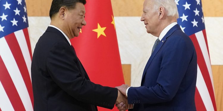 US President Joe Biden (R) and Chinese President Xi Jinping shake hands before their meeting on the sidelines of the G20 summit meeting, November 14, 2022, in Nusa Dua, in Bali, Indonesia. (AP Photo/Alex Brandon)