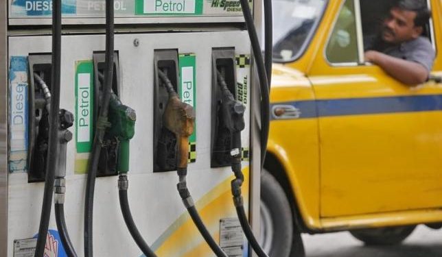 A driver waits in a taxi for his turn to fill up his tank with diesel at a fuel station in Kolkata June 14, 2012. REUTERS/Rupak De Chowdhuri/Files