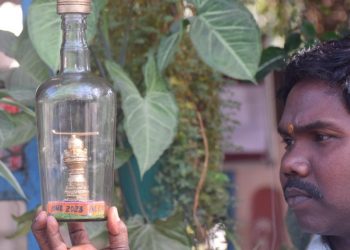 Odisha-based artist creates miniature hockey stick & ball inside a bottle