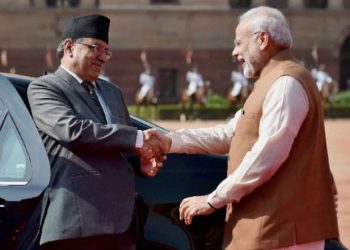 Prime Minister Narendra Modi greets Nepalese counterpart Pushpa Kamal Dahal