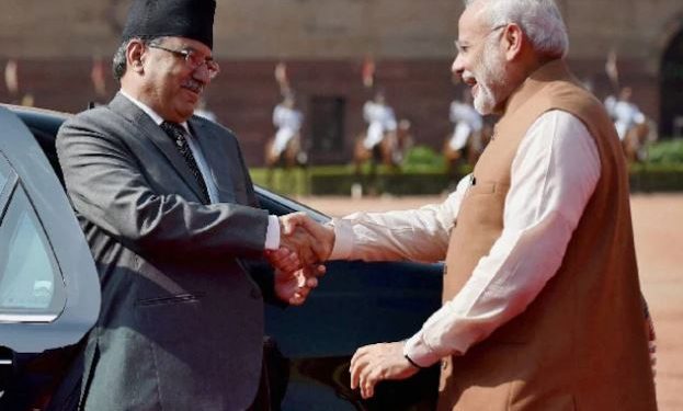 Prime Minister Narendra Modi greets Nepalese counterpart Pushpa Kamal Dahal