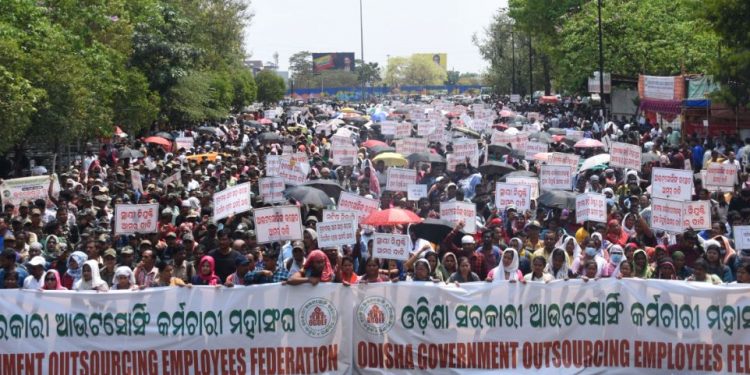 Outsourcing employees hit streets for job regularisation