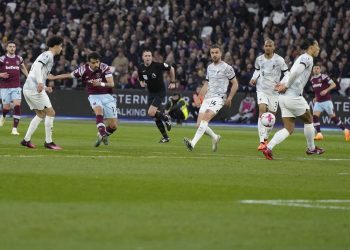 West Ham's Lucas Paqueta scores his side's first goal during the English Premier League soccer match between West Ham United and Liverpool at the London stadium in London, Wednesday, April 26, 2023. (AP Photo/Alastair Grant)