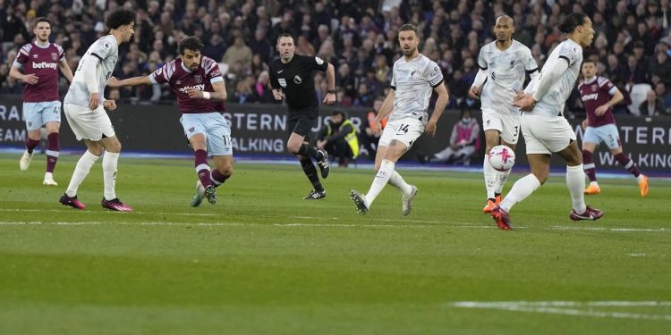 West Ham's Lucas Paqueta scores his side's first goal during the English Premier League soccer match between West Ham United and Liverpool at the London stadium in London, Wednesday, April 26, 2023. (AP Photo/Alastair Grant)