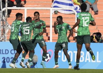 Nigeria's Samson Lawal, 18, celebrates scoring his side's second goal against the Dominican Republic with teammates during a FIFA U-20 World Cup group D soccer match at the Malvinas Argentinas stadium in Mendoza, Argentina, Sunday, May 21, 2023. (AP Photo/Natacha Pisarenko)