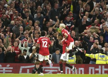 Manchester United's Marcus Rashford celebrates after scoring his side's fourth goal during the English Premier League soccer match between Manchester United and Chelsea at the Old Trafford stadium in Manchester, England, Thursday, May 25, 2023. (AP Photo/Dave Thompson)