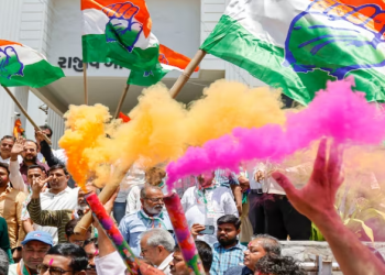 Congress workers celebrate at the party office after the party’s victory in the Karnataka Assembly elections, outside Rajiv Gandhi Bhawan in Ahmedabad (PTI Photo)