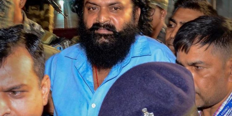 Self-styled supremo of proscribed People's Liberation Front of India, Dinesh Gope being brought back to Jharkhand after his arrest by NIA in Delhi (Image: PTI)