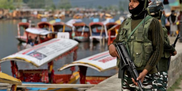 Central Reserve Police Force (CRPF) personnel stand guard on the banks of Dal Lake, a famous tourist attraction, in Srinagar ahead of G20 meet (File: Reuters)