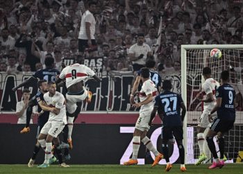 Stuttgart's Serhou Guirassy, center left, scores his side's third goal of the game during the first leg of the German Bundesliga relegation soccer match between Stuttgart and Hamburger at the Mercedes-Benz Arena in Stuttgart, Germany, Thursday, June 1, 2023. (Tom Weller/dpa via AP)