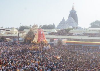 Puri Rath Yatra 2023: Taladwaj reaches Gundicha; Lord Jagannath's journey to continue Wednesday Puri: A tidal wave of humans pulled forward giant chariots of Jagannath, Lord of the Universe, and his two siblings Tuesday from a 12th century stone temple in the heart of this sea-side pilgrimage town to their alternate abode about 3 km away. Muscles glistening in the setting sun, thousands of bare-chested men pulled the three nearly 45 feet tall wooden chariots of Lords Jagannath and Balabhadra and Devi Subhadra, while lakhs more thronged to touch, pray or just watch the huge procession. Odisha Governor Ganeshi Lal and Chief Minister Naveen Patnaik symbolically started the mammoth car pulling exercise by pulling on the ropes connecting the principal Jagannath Chariot. Though it was scheduled earlier that all the chariots will reach the destination at Shree Gundicha Temple by 6 PM, only Lord Balabdhara's chariot Taladwaj could reach the destination while Devi Subhadra's Darpadalan remain stranded about 200 metres from the destination by 8 PM. Lord Jagannath's Nandighosh chariot was stationed near Balagandi Chhak and it will be pulled Wednesday. Rhythmically beating brass cymbals and hand drums, priests surrounded the gods on the canopied chariots as the procession made its slow and serpentine way through the main street of this temple town. The air rented with "Jai Jagannath" and "Haribol" as frenzied devotees tried to get a glimpse of what is regarded as a holy occasion by most Hindus, especially Vaishnavites. A million devotees are estimated to have converged on this town for the annual car festival. While most devotees were from Odisha and neighbourng states, many from abroad too joined in what is considered one of the largest religious processions globally. Earlier in the day, Divya Singha Deb, the Gajapati Maharaja of Puri, Tuesday ritualistically swept the chariots with a broom with a golden handle, as priests sprinkled flowers and fragrant water. Different groups performed 'kirtans' (religious songs) and danced in front of the chariots before the procession started. Tight security arrangements were made by the district administration and police to ensure a successful festival. The annual Rath Yatra, which marks the nine-day sojourn of Lord Jagannath is held every year on ‘Dwitiya Tithi' (second day) of ‘Shukla Pakshya' (the fortnight after full moon) in the month of Ashada (June-July) according to the Hindu almanac. The chariot pulling started after the Puri's titular king completed the ‘Chhera Pahanra' (Chariot sweeping) ritual. The wooden horses were fitted on the chariots and the servitor pilots guided the devotees to pull the chariots in the right direction. "Enthusiasm among all, including the servitors who look after the Lords, was palpable and rituals were completed before time," said Shree Jagannath Temple Administration (SJTA) Ranjan Kumar Das. The big brother Lord Balabhadra was the first to come out of the temple followed by Lady Subhadra and later Lord Jagannath himself. While Lord Balabhadra was seated on Taladwaj chariot, Lord Jagannth adorned the chariot named Nandighosh, Chakra Raj Sudarsan was seated at the chariot of Devi Subhadra's Darpadalan chariot. Puri Shankaracharya Swami Nisachalanada Saraswati was also present at the start of the procession. During the car pulling, some people fell at Marichkote Chhak as Lord Balabhdara's chariot was passing, officials said, adding that five of them were rushed to a hospital for treatment using a special green corridor created for transferring patients from the crowded route to medical centres and hospitals elsewhere. President of India Droupadi Murmu, Prime Minister Narendra Modi, Union Home Minister Amit Shah and others have greeted the devotees on the occasion of the Rath Yatra. The district administration made elaborate arrangement for the devotees keeping in view the prevailing hot and humid weather. PTI Puri, Jagannath temple, Rath Yatra