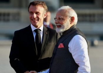 French President Emmanuel Macron and Indian Prime Minister Narendra Modi shake hands ahead of a dinner held at the Louvre in Paris. (PC: Reuters)