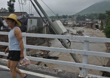 Chinese state media says flooding around Beijing kills 11; 27 people missing