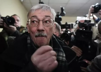 Russian court sentences co-chair of a Nobel-winning rights group to 30 months in prison